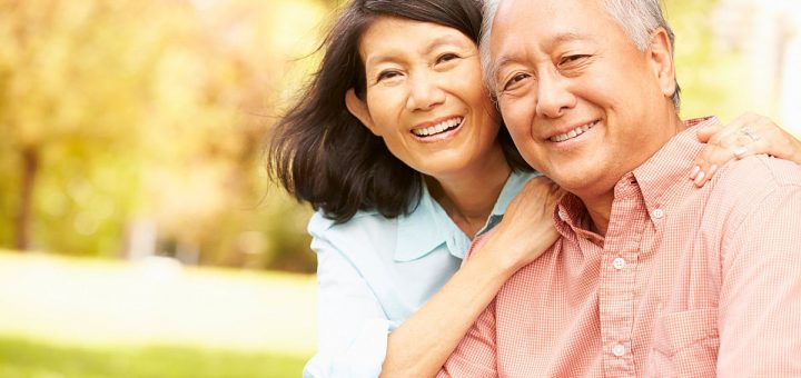 Portrait Of Senior Couple Sitting In Park Together; Unions and Retirement Benefits concept