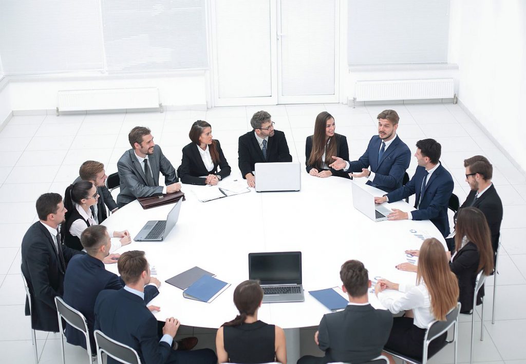 meeting in a conference room; union's first contract concept