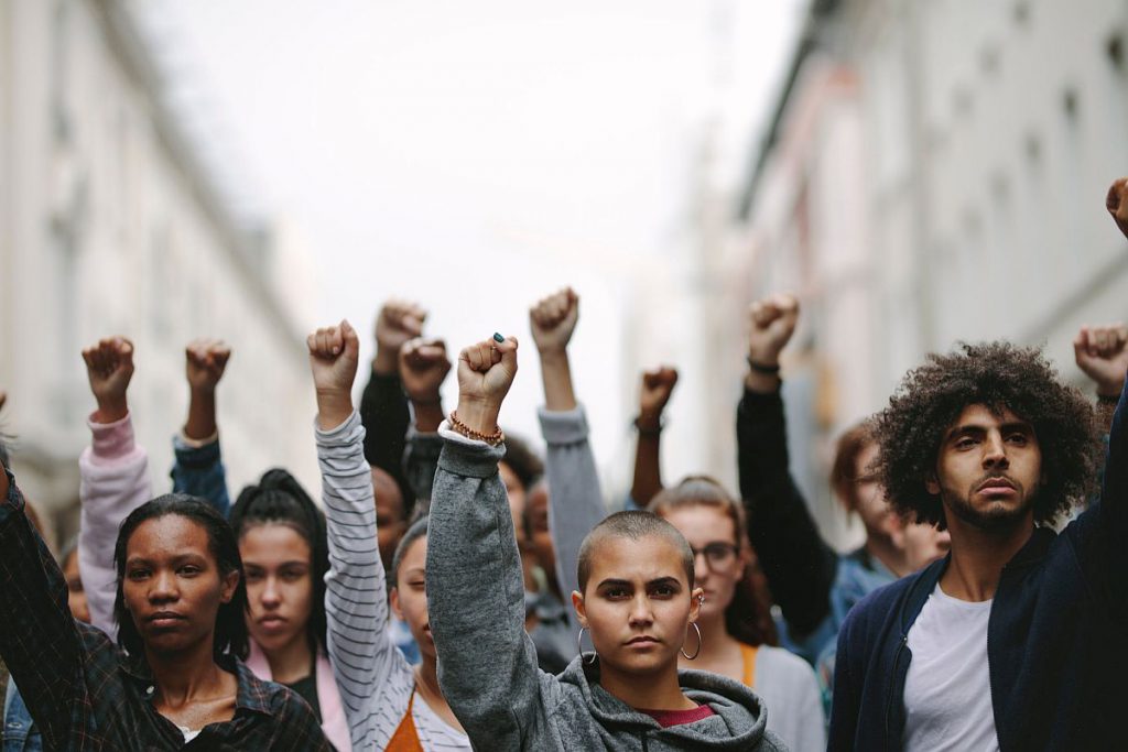 Activists protesting on the street; worker unions gains concept