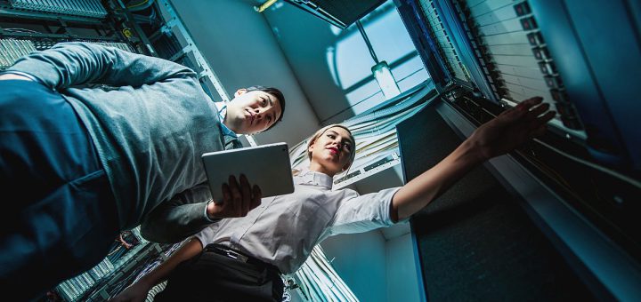 Young engineers in network server room; union drives spring 2022 concept