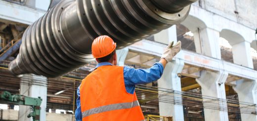 Worker in hard hat in factory; concept next generation of workers