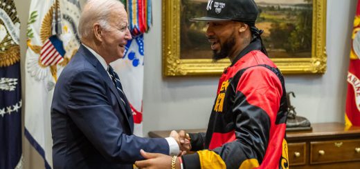 President Biden shaking hands with Amazon union organizer Christian Smalls; Young union organizers concept