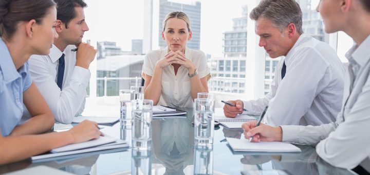 Professionals meeting in a boardroom; contract negotiations concept