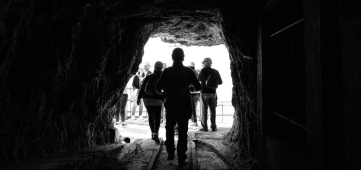 People at entrance to mine; warrior met coal strike concept